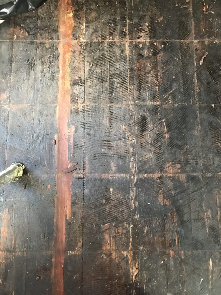 P.O.R.S. vinyl floor removal & Adhesive removal on hardwood floor.