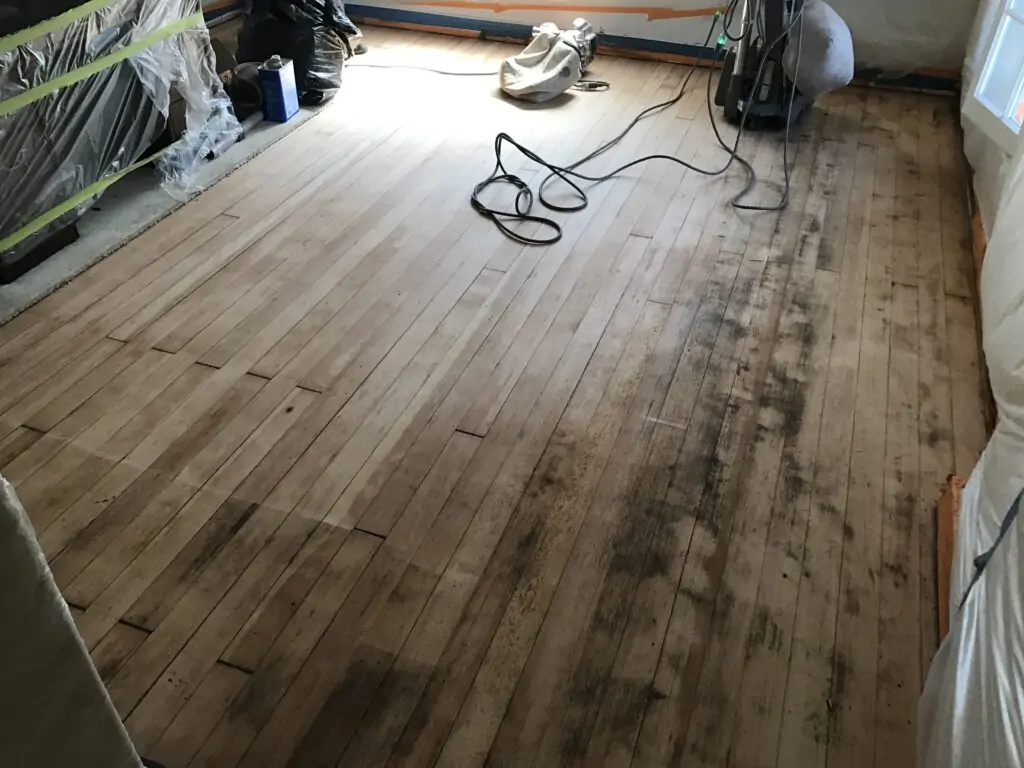 P.O.R.S. Carpet Job turns into vinyl floor removal & Adhesive removal on hardwood floor. Sanding Hardwood floors before applying odor encapsulator.