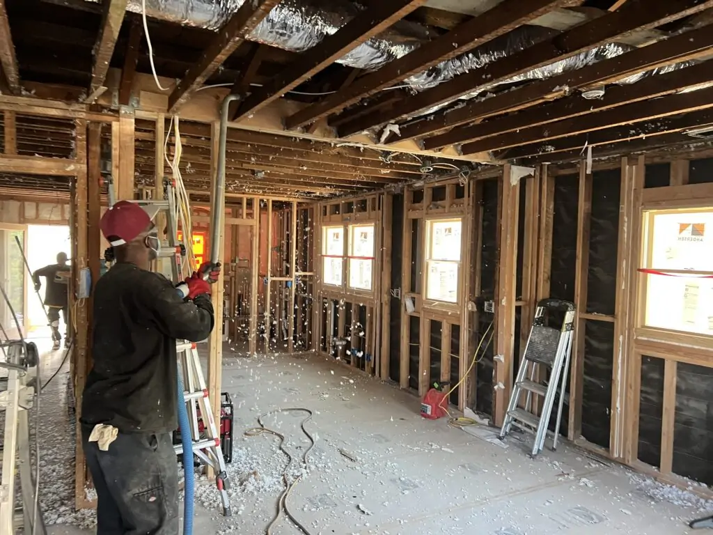 Drywall removed and wall framing exposed for treatment on a P.O.R.S. job site