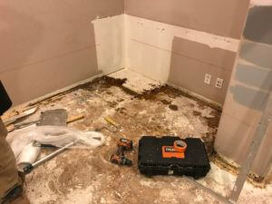 Orange County Pet Odor Removal Service Photo Showing Removing Built In Cabinetry Removed Because of Damage From Dog Urine In a house.