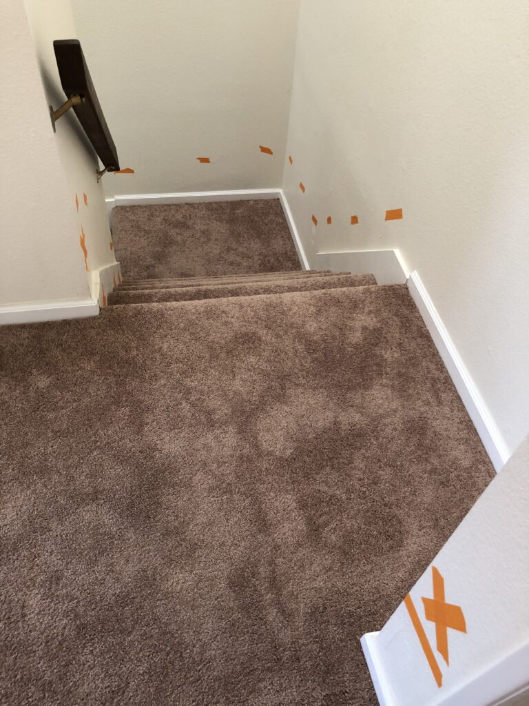 Pet odor home inspection orange tape denotes cat spray on walls in a remodeled home.
